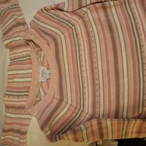 A sweater or top? Has a scarf attached.